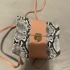 Pink, black and white purse